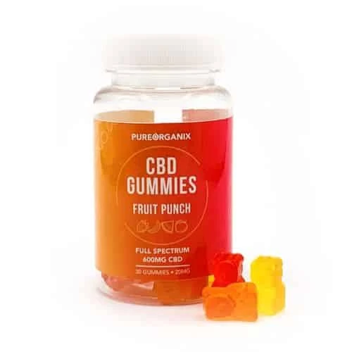 PureOrganix CBD Gummies bottle labeled "Fruit Punch" containing 600mg full-spectrum CBD with 30 gummies (20mg each), shown alongside red, orange, and yellow bear-shaped gummies.