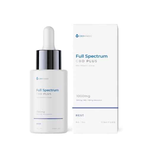CBD Magic Full Spectrum CBD Plus Tincture for Rest – A sleek white bottle with a silver dropper cap, placed next to its matching white box. The label highlights 1000mg strength with 900mg CBD and 50mg melatonin, designed for promoting rest and relaxation.